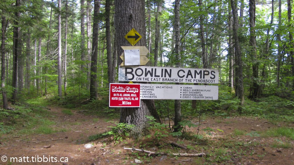 On the Eagle Lake Tote Rd. Go right for Bowlin Camps. The trail continues to the left of this sign.