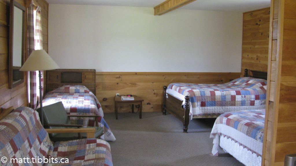 Lots of beds in the bedroom.